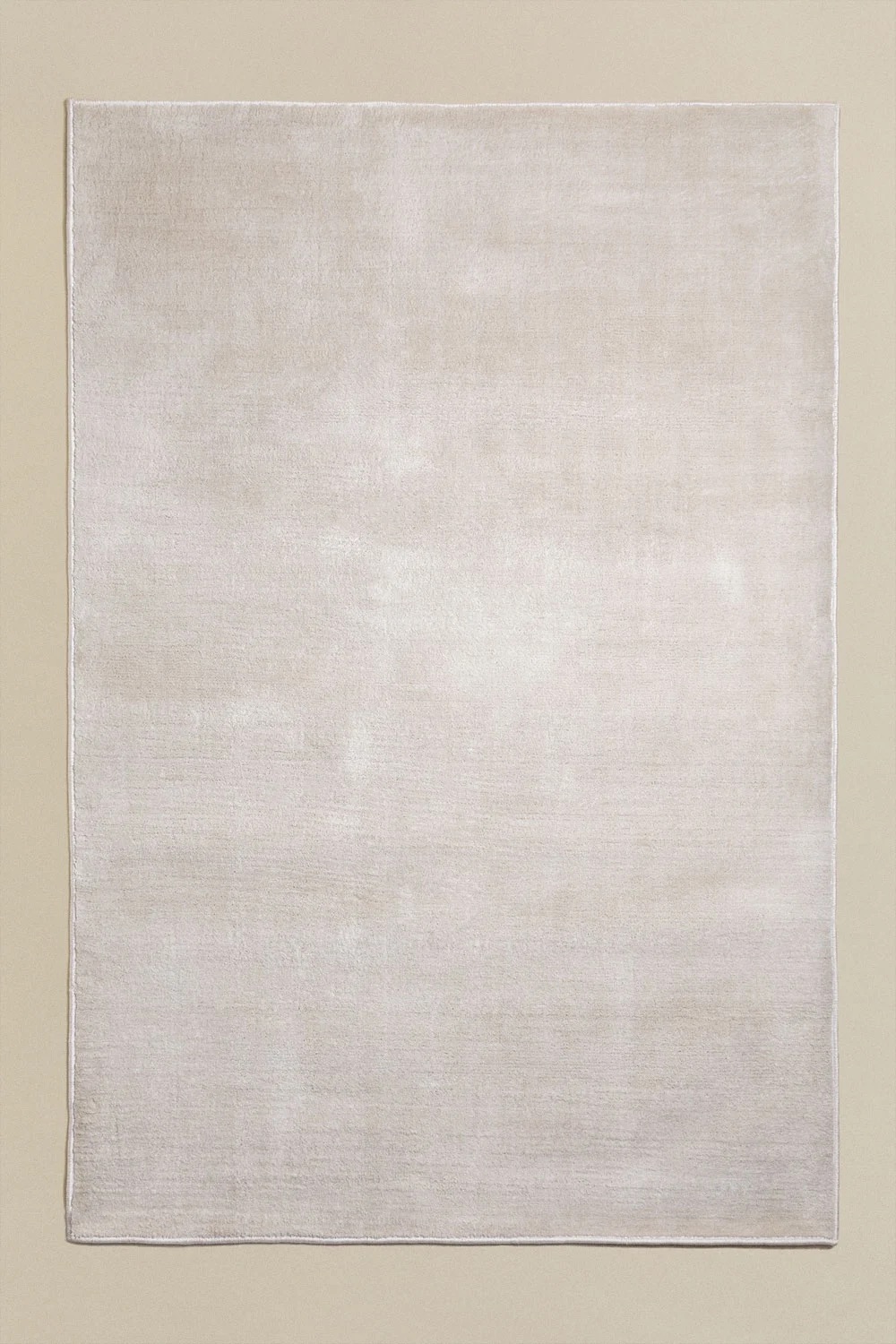 Alfombra lisa de pelo corto en tono crudo/beige